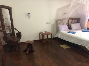 Letto o letti in una camera di Sigiri Lion Lodge