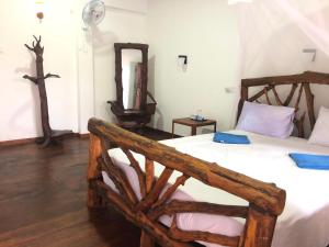 Letto o letti in una camera di Sigiri Lion Lodge