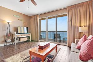 a living room with a view of the ocean at Calypso Resort in Panama City Beach