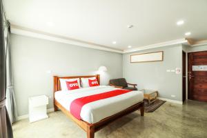 เตียงในห้องที่ OYO 150 3Q Chiangmai Residence