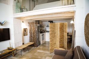 a living room with a couch and a table at Civico 5 in Alberobello