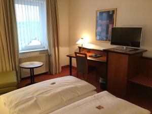 Postel nebo postele na pokoji v ubytování Garni Hotel Schmaus