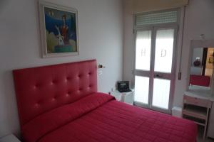 Voodi või voodid majutusasutuse Hotel Diga toas