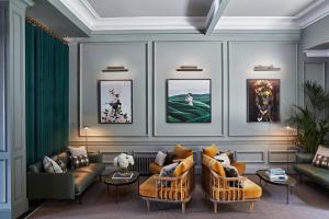 
a living room filled with furniture and a painting on the wall at Kimpton - Charlotte Square, an IHG Hotel in Edinburgh
