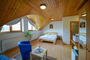 A bed or beds in a room at Penzion Fantazia Poprad - Self check-in