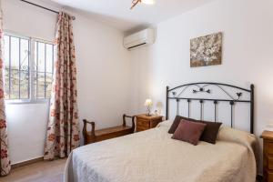 Posteľ alebo postele v izbe v ubytovaní Cortijo Tomé