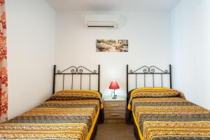 Posteľ alebo postele v izbe v ubytovaní Cortijo Tomé