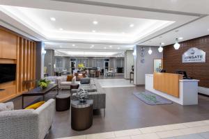 an office lobby with couches and a waiting room at Hawthorn Extended Stay by Wyndham Loveland in Johnstown