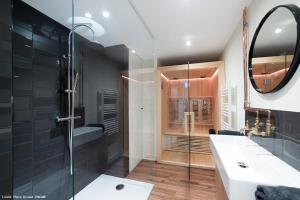 a bathroom with a shower and a sink and a mirror at Le Juliette in Lyon