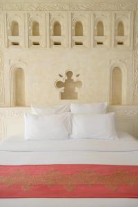 Een bed of bedden in een kamer bij Swahili Beach