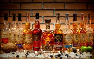 a group of bottles of alcohol sitting on a counter at Pavlos Hotel in Kos Town