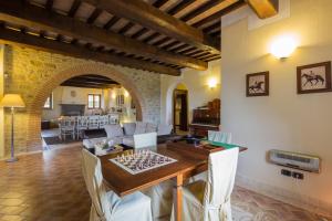 a living room with a table and a couch at Villa dei Tramonti in Passignano sul Trasimeno