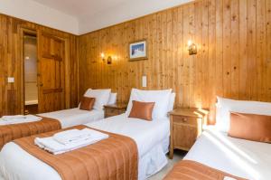 Postel nebo postele na pokoji v ubytování Hotel Sylvana