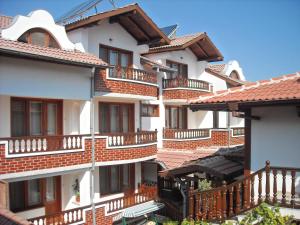 a row of apartment buildings with balconies at Boyadjiyski Guest House in Bansko