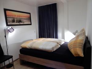 Säng eller sängar i ett rum på Altstadt Charme
