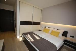 Postel nebo postele na pokoji v ubytování Villa Infinity