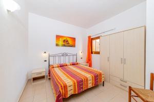 A bed or beds in a room at Centro Residenziale Le Canne