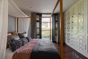 a bedroom with a bed and a large window at Umhlanga Beach Villa in Durban +55 photos