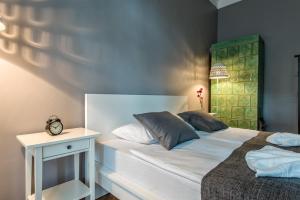 Posteľ alebo postele v izbe v ubytovaní Sereno Apartments
