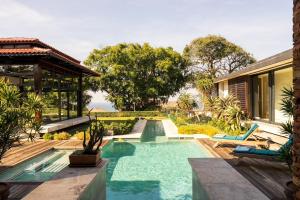 a swimming pool in the middle of a house at Umhlanga Beach Villa in Durban