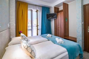Postel nebo postele na pokoji v ubytování Pod Wzgórzem Bed & Breakfast