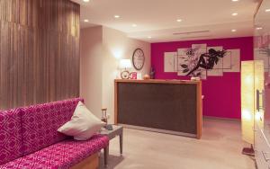 a living room with a couch and a projection screen at ... mein romantisches Hotel Toalstock in Fiss