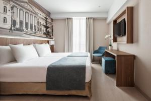 Ein Bett oder Betten in einem Zimmer der Unterkunft Exe Saldanha