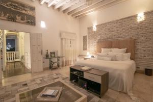 Postel nebo postele na pokoji v ubytování Hotel Boutique Don Pepe