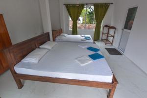 Postel nebo postele na pokoji v ubytování Mallika Resort