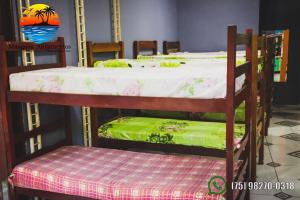 a couple of bunk beds in a room at tabasco in Morro de São Paulo