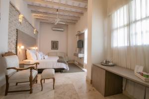 Postel nebo postele na pokoji v ubytování Hotel Boutique Don Pepe