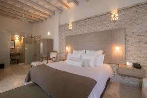 Postel nebo postele na pokoji v ubytování Hotel Boutique Don Pepe