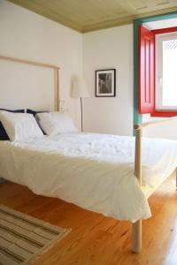 Postel nebo postele na pokoji v ubytování São Gião House 4