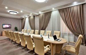 a large conference room with a long table and chairs at Paradise Hotel Baku in Baku