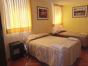 Un ou plusieurs lits dans un hébergement de l'établissement Mango Hostel B&B