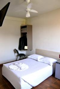 Postel nebo postele na pokoji v ubytování Hotel Caçula
