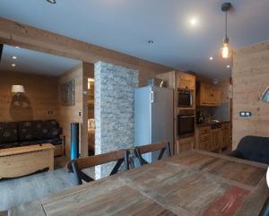 Kuchyň nebo kuchyňský kout v ubytování Les Appartements de Maé