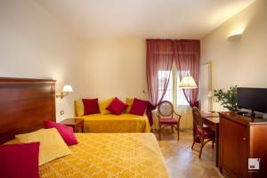 TV a/nebo společenská místnost v ubytování Hotel Alessandro Della Spina