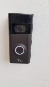 a black fire camera sitting on a wall at Cottage Grove Homestay rooms in Portsmouth