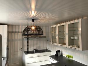 a kitchen with a sink and a ceiling at le gite des chantoires in Aywaille +44 photos
