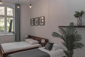 Posteľ alebo postele v izbe v ubytovaní 3D Wawel Apartament