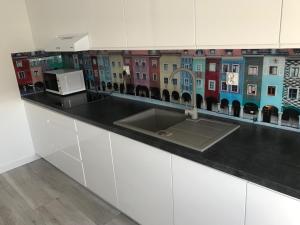 Kuchyňa alebo kuchynka v ubytovaní Apartament Malta Supreme