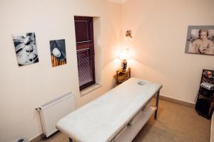 מיטה או מיטות בחדר ב-Garni Hotel Vila Milord Resort