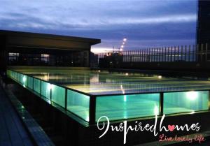a building with a pool of water on top of it at Inspired Homes @ PJ The Grand Sofo in Petaling Jaya