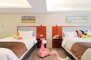 Postel nebo postele na pokoji v ubytování Shanghai Menglong Hotel Management