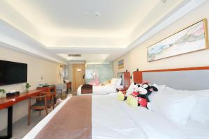 Postel nebo postele na pokoji v ubytování Shanghai Menglong Hotel Management