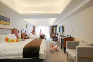 TV a/nebo společenská místnost v ubytování Shanghai Menglong Hotel Management