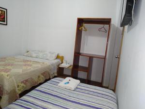BACHÍG Hospedaje客房内的一张或多张床位