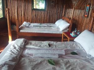 Letto o letti in una camera di Sipi Coffee Lodge