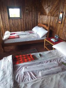 Letto o letti in una camera di Sipi Coffee Lodge